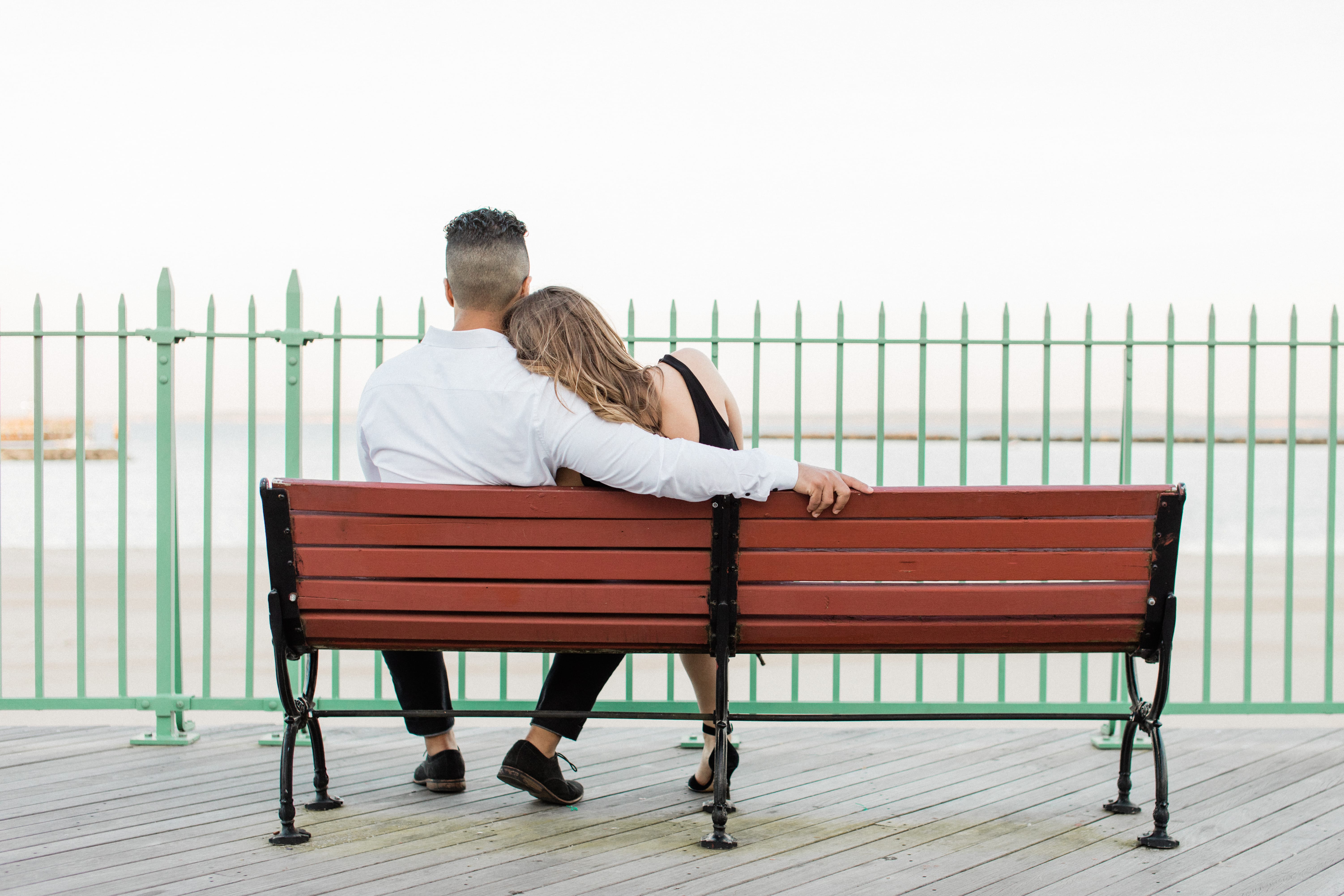 Couple Cuddling on Park Bench