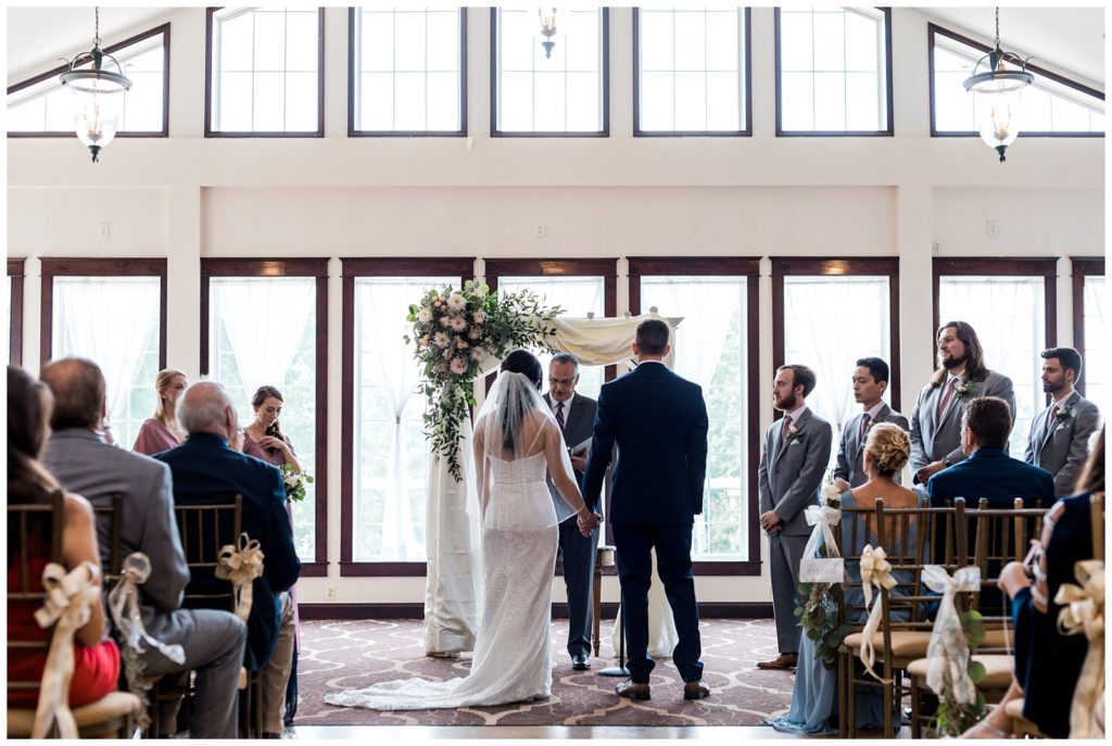 wide angle photograph of an indoor summer wedding ceremony in new jersey 