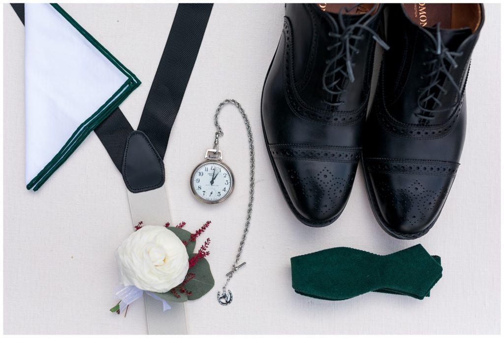 groom's details including suspenders, pocketwatch and bowtie