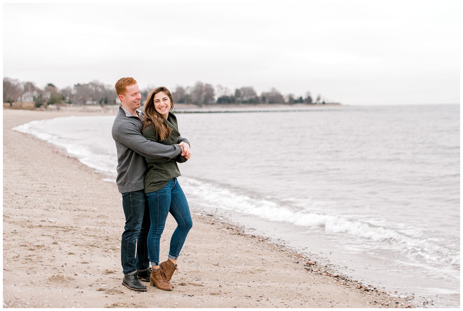 couple hugging at the beach in Westport, Connecticut