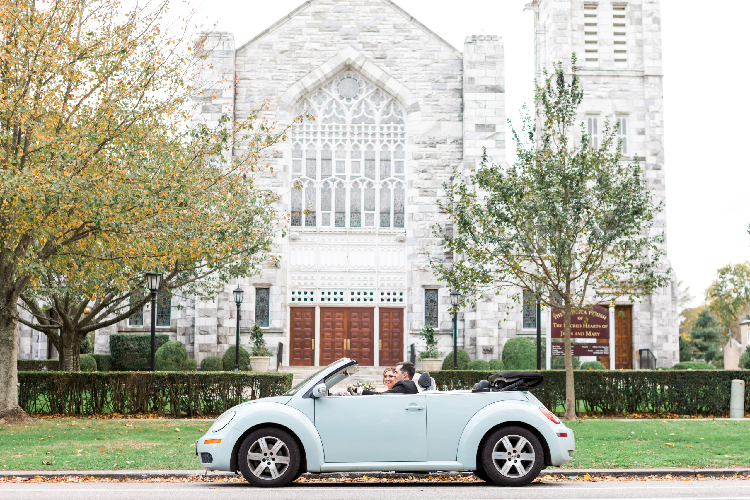 Southampton, NY Bride and Groom in Vintage Car in Front of Cathedral
